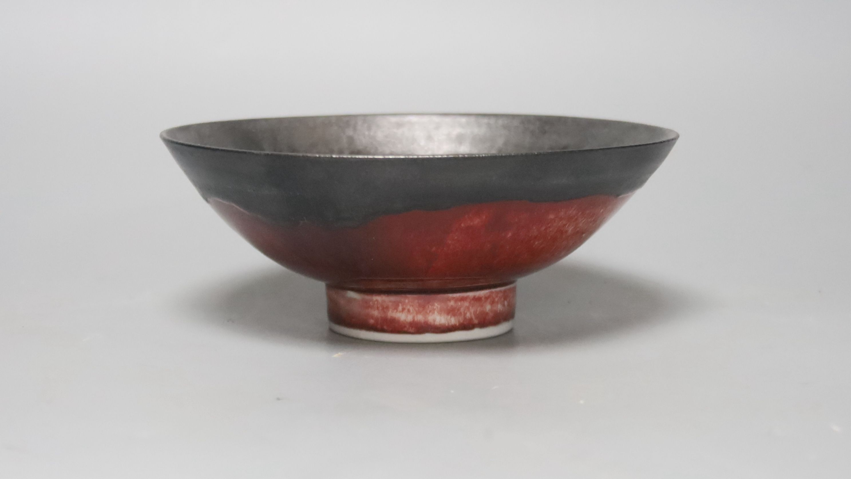 Eddie Curtis (b.1953), a copper red bowl, 16cm